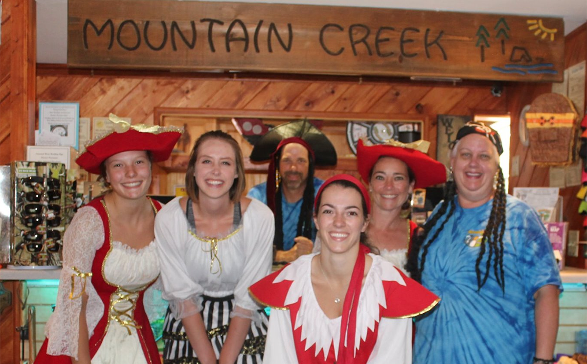 Mountain Creek Campground staff dressed as pirates during a themed camping weekend inside the camp store.